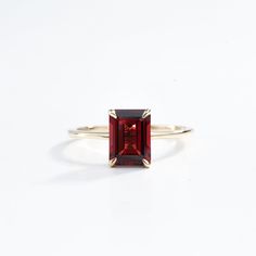 Emerald Cut Garnet Engagement Ring in Solid Gold - Red Garnet January Birthstone, Anniversary Gift Ring for Her This elegant emerald cut garnet engagement ring features a stunning red garnet set in solid gold. As the January birthstone, it makes a perfect anniversary or special occasion gift for her, blending classic beauty with a personal touch. Same design can be made also with other custom gemstones per request.  Product details: Stone - Natural Garnet Size - 6x8 Color - Red Metal - Solid Gol Fine Jewelry Red Ruby Ring, Red Ruby Ring With Baguette Cut Center Stone, Formal Ruby Solitaire Birthstone Ring, Elegant Red Sapphire Solitaire Ring, Formal Red Birthstone Ring With Prong Setting, Elegant Red Solitaire Sapphire Ring, Classic Red Birthstone Ring, Red Baguette Cut Ruby Ring, Formal Red Sapphire Ring