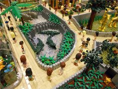 a lego model of a zoo with people and animals