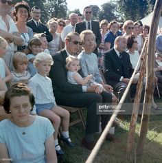 a large group of people are sitting in chairs