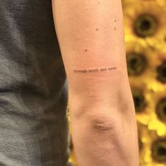 a person with a small tattoo on their arm