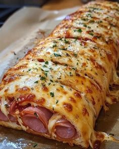 the ham and cheese pizza is ready to be eaten