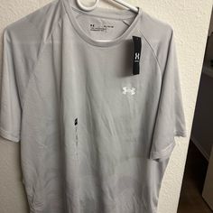 an under armour shirt hanging on a wall