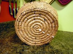 a woven basket sitting on top of a table