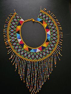 CLEARANCE SALE! Wholesale Zulu necklaces set of 2 , African jewelry for wedding ,multicolor necklace , Shoulder necklace. This listing is for ALL 5 necklaces exactly like shown above. All for $59 Size: Check more photos for sizes. **Buy multiple items and pay shipping for 1 item only.The rest ships free. More neckleces here; https://www.etsy.com/shop/TribalTess?ref=seller-platform-mcnav§ion_id=21306083 Back to my shop; https://www.etsy.com/shop/TribalTess?ref=seller-platform-mcnav Multicolor Choker Necklace For Celebration, Yellow Choker Necklace With Colorful Beads, Bohemian Yellow Necklaces For Wedding, Bohemian Multicolor Bridal Necklace With Round Beads, Multicolor Celebration Choker Necklace, Colorful Choker Jewelry Gift, Multicolor Bib Necklace Choker As Gift, Multicolor Bib Necklace Choker For Gifts, Gift Multicolor Choker Bib Necklaces