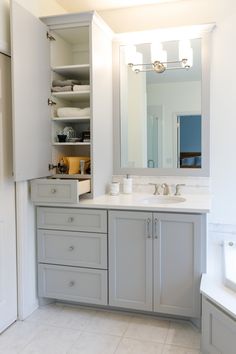 a bathroom with two sinks and a large mirror