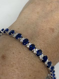 Vintage Cubic Zirconia Bracelet Clear blue Crystal Tennis 7.5 inches All jewelry is shipped free in the US in a nice gift box. Check out our over a THOUSAND great reviews Engraving is $4 per letter and is not always perfect depending on the piece. It can take a few days if the jeweler is busy. This is payable to Paypal Judithsltd@gmail.com Elegant Blue Bracelets With Sparkling Stones, Blue Sapphire Tennis Bracelet With Gemstone, Blue Sapphire Bracelets For Anniversary, Sapphire Diamond Tennis Bracelet Gift, Blue Cubic Zirconia Tennis Bracelet Fine Jewelry, Blue Sapphire Gemstone Tennis Bracelet, Blue Cubic Zirconia Bracelet Gift, Aaa Quality Sapphire Jewelry For Gift, Oval Blue Diamond Bracelets