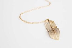 Long Gold Feather Necklace Gold Feather Necklace Perfect For Gifting, Gold Feather Necklace For Gift, Gold Necklace With Feathers As A Gift, Gold Necklace With Feathers For Gift, Elegant Feather Jewelry As Gift, Elegant Feather Jewelry Gift, Elegant Feather Jewelry For Gift, Amy Stewart, Gold Feather Necklace