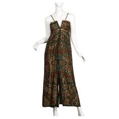 Gorgeous vintage 1970s gold lamé paisley silk evening gown by Pauline Trigere. Versatile zip up front allows you to be either daring or discreet. Fully lined in a gold metallic silk, front zip and hook closure. Fits like a modern size small. The bust measures 32-35" (zipped-unzipped), empire waist 26", hips 39" and the total length 53". Excellent vintage condition with no noted flaws. Vintage Halston Dress, Pauline Trigere, Vintage Halston, Halston Dress, Silk Evening Gown, Gold Lame, Empire Waist Dress, Empire Dress, Vintage 1970s