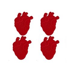 three red heart shaped magnets on a white background