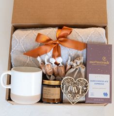 a gift box with coffee, cookies and other items for someone's special occasion