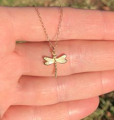 Dragonfly necklace, gold dragonfly pendant, bug necklace, dainty gold necklace, insect necklace, tiny dragonfly in gold, whimsical This itty bitty gold vermeil dragonfly hangs happily from a 14k gold filled chain at the length of your choice! This beauty measures 13mm Need a few reasons to love a dragonfly other than for its beauty? A dragonfly symbolizes change in the perspective of self realization and the understanding of the deeper meaning of life Looking for other charm necklaces? https://w Gold Dragonfly Necklace For Gift, Handmade Gold Dragonfly Jewelry, Bug Necklace, Insect Necklace, Deeper Meaning, Dragonfly Necklace, Dragonfly Pendant, Self Realization, Dainty Gold Necklace