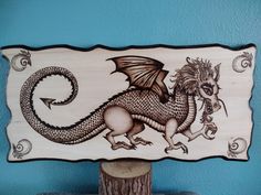 a wooden sign with a dragon on it