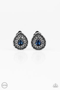 Encircled in glassy white rhinestones, a teardrop blue gem is pressed into the center of an ornate silver teardrop gem for a glamorous look. Earring attaches to a standard clip-on fitting. Sold as one pair of clip-on earrings. Glamorous Look, Paparazzi Accessories, Blue Gems, White Rhinestone, Sapphire Earrings, Paparazzi Jewelry, High Class, Rhinestone Earrings, Blue Earrings