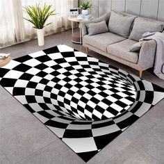 a black and white area rug with an abstract design on the floor in front of a couch