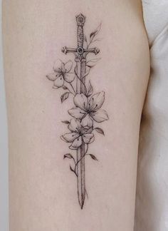 Side Tattoos Women Simple, Knife Spine Tattoos For Women, Simple Garden Tattoo, Sward Flower Tattoo, Acotar Dagger Tattoo, Fine Line Dagger Tattoo, Dagger And Flower Tattoo, Dagger With Flowers Tattoo, Dagger Flower Tattoo