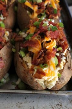 baked potatoes with bacon, cheese and green onions