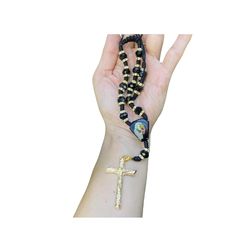 This gorgeous Saint Benedict Adjustable Auto Rosary is handmade from Mexico made of black nylon thread with Gold plated crucifix. It is adjustable with a toggle back and features a clasp which crucifix which can be changed. It can fit a small child to adult or use to hang over your rearview mirror to bring blessing to the wearer or the car in which it hangs. It measures 15 inches from the nape to the tip (measured while folded lengthwise).Gold plated products are durable; however, please remember to apply beauty products such as perfume, hairspray or deodorant before wearing your jewelry as certain chemicals in these products may damage the finish. Always remove your jewelry before swimming, bathing, doing household chores or using abrasive cleaners. To clean your jewelry just use warm wat Adjustable Black Rosary With Cross, Adjustable Black Cross Rosary, Adjustable Black Spiritual Rosary, Saint Benedict, Gold Candles, Household Chores, Color Help, Abalone Shell, Rearview Mirror