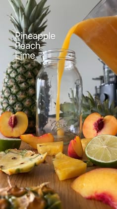 pineapple peach lime juice being poured into a mason jar