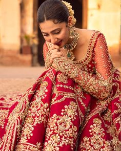 Red Lehenga and Choli Raw Silk Pakistani Bridal Dress is adorned with dabka, kora, and zardosi. This beautiful Bridal Lehenga Choli is emblazoned with intricate designs, embroidery, and goldwork, making it a perfect choice to have a magnificent look at the wedding. Bridal Choli: The choli is emblazoned with embroidery, tilla, and goldwork. This beautiful choli is adorned with glamorous details of shimmering ornaments, sequins, and sitara work, making it a perfect choice to pair with the Pakistan Red Bridal Lehenga Pakistani, Bridal Lehenga Pakistani, Pakistani Bridal Lehenga, Pakistani Lehenga, Red Lehenga Choli, Pakistani Bridal Dress, Red Bridal Dress, Bridal Dupatta, Bridal Details