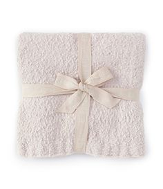 a white blanket with a bow on it