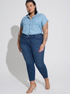 FIT Model is 5'9” wearing size 1. Measures 31” from shoulder (size 2). . MATERIALS + CARE Chambray woven fabric. 100% tencel. Machine wash cold. . Imported. DETAILS Collared. . Dolman sleeves. Button front. Chest pockets. The best plus size women's button up dolman chambray shirt & denim shirts in light blue made of tencel. Torrid is your destination for the freshest spring and summer styles. Torrid is your destination for plus size SALE > CLEARANCE merchandise. Dolman Shirt, Shirt Outfits, Peplum Shirts, Denim Shirts, Cute Blouses, Summer Styles, Chambray Shirt, Best Jeans, Slim Fit Shirt