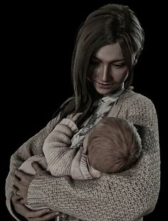 a woman holding a baby in her arms