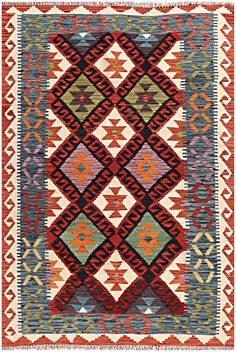 an old rug with different colors and patterns