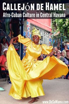 a woman in yellow is dancing on the street