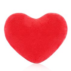 a red heart shaped pillow on a white background