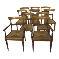 set of eight chairs with cane back and armrests