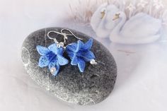 Bluebell Earrings - Blue Lace Earrings - Fairy Earrings - Spring Flowers - Bell Flower - Bluebell Embroidery - Something Blue - Lace Flower Don't miss these Delicate Lace Bluebell Flower Earrings. Their unique, elegant and feminine design is perfect for weddings as 'Something Blue' and as a gift for all flower loving mum's, girlfriends or just for yourself. Bell Flower dimensions: 2 cm length * 2.7 cm wide Earring Length: 4.7 cm Ear hooks made from zinc alloy Thank you for your visit. You may al Blue Flower-shaped Earrings With Ear Wire, Blue Handmade Flower Drop Earrings, Blue Drop Earrings With Handmade Flowers, Handmade Blue Flower Earrings For Wedding, Blue Handmade Flower Earrings, Handmade Blue Flower Earrings, Blue 3d Flower Drop Earrings, Blue 3d Flower Earrings For Wedding, Blue Elegant Earrings With 3d Flowers