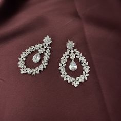 Our Stunning MOISSANITE Earrings with Swarovski Crystals and Cubic Zirconia are Absolutely Gorgeous. MOISSANITE Drop Earrings can be styled with most Bridal Headpieces and will add glitter and glamour to your amazing special day. Handcrafted Unique Design Highest Quality & Finest Materials Brilliant SWAROVSKI Crystals Cubic Zirconia Rhodium / Platinum plated gives a luxurious shine and luster. It has a brilliant silver tone and guards against scratches and tarnish. Earrings Drop Length is ap Drop Bridal Earrings, Jewerly Set, Crystals Earrings, Boutique Couture, Bridal Earrings Drop, Moissanite Earrings, Your Amazing, Headpiece Wedding, Bridal Hair Comb