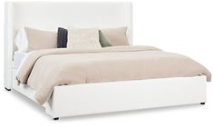 a white bed with two pillows on top of the headboard and bottom foot board