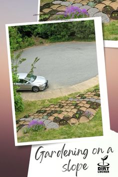 a car parked on the side of a road next to a stone wall and flower bed