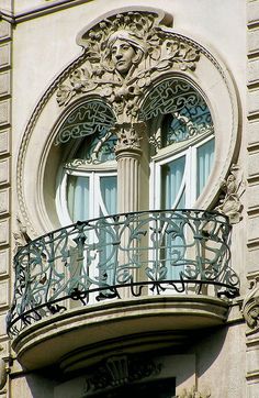 an ornate balcony and balconies on the side of a building