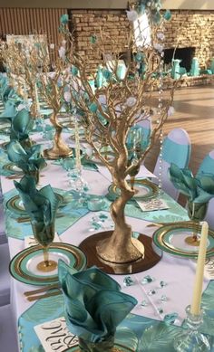 the tables are set with blue and gold decorations