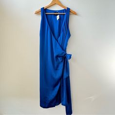 New With Tags Gap Royal Blue Satin Wrap Dress Size L. In Near Perfect Condition But Does Have One Tiny Flaw Noted In The Last Picture Looks Like One Of The Threads Got Caught. I’m Not Sure If I Did This In Trying It On Once Or I Got It Like This :/ Priced Accordingly! It’s Honestly Barely Noticeable. I Try To Ship Next Day (Or Same Day When Possible)! Please Let Me Know If You Have Any Questions. All Measurements Are Approximate. P2p: 19” No Stretch Length: 39” Elegant V-neck Gap Dress, Blue Midi Length Wrap Dress For Summer, Elegant Gap Midi Dress For Spring, Chic Gap Midi Dress For The Beach, Blue Midi Length Wrap Dress For Beach, Elegant V-neck Midi Dress By Gap, Chic Beach Midi Dress By Gap, Chic Blue Wrap Dress For Summer, Blue Wrap Dress For Summer Evening