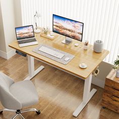 an office desk with two computers on it