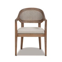 the arm chair is made from wood and has a beige upholstered fabric seat