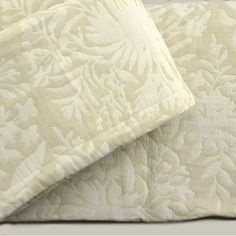 two white pillows sitting next to each other