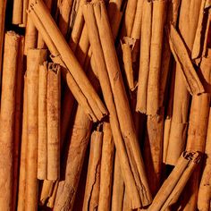 several bundles of cinnamon sticks stacked on top of each other