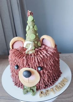 a birthday cake decorated to look like a bear