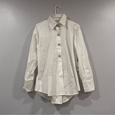 On Sale Is A Jason Wu Pearl Button Cotton Poplin White Shirt Small S. It Is New With Tags. The Measurements Are Approximations Length Of Back (Shoulder To Hem)- 30 3/4 Inches Width (Pit To Pit)- 23 Inches Trendy White Buttoned Shirt, Trendy White Shirt With Buttons, White Button Closure Shirt For Fall, White Button-up Shirt With Covered Buttons, White Shirt With Shirttail Hem And Buttons, Trendy Button-up Workwear Shirt, Cotton Button-up Blouse With Snap Buttons, Chic White Shirt With Buttons, Casual Office Tops With Covered Buttons