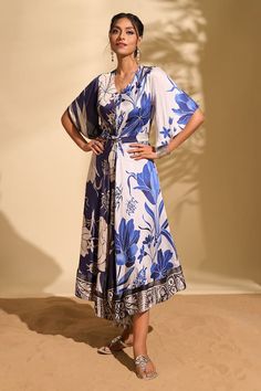 White, blue tie-up dress with floral print and bead embroidery. - Aza Fashions Elegant Printed Midi Beach Dress, Elegant Blue Floral Dress With Short Sleeves, Blue Floral Print Dress For Evening, Blue Floral Print Evening Dress, Blue Floral Dress For Evening, Elegant Printed Floral Beach Dress, Elegant Printed Floral Dress For Beach, Elegant Silk Maxi Floral Dress, Elegant Printed Dresses For Garden Party