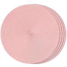 four pink placemats are arranged on top of each other, with one circle in the middle