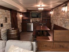 a living room filled with furniture and a flat screen tv on top of a wooden table