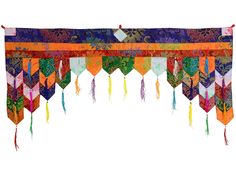 an orange and purple curtain with tassels hanging from it's sides on a white background