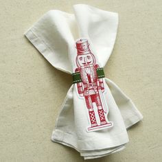 a white napkin with a red and green design on it