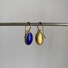 Striking blue Afghanistan lapis lazuli cabochons rest serenely within pristine gold bezels to make an effortlessly regal pairing. 18k yellow gold Lapis lazuli, 9.4ctw, 9mm x 13mm (3/8" x 1/2") Earrings hang 15/16" from the ear Each earring weighs 2.4g Yellow Gold Cabochon Drop Earrings, Gold Lapis Lazuli Gemstone Earrings, Elegant Gold Lapis Lazuli Earrings, Timeless Blue Oval Cabochon Jewelry, Gold Lapis Lazuli Jewelry With Cabochon, Gold Lapis Lazuli Cabochon Jewelry, Elegant Blue Oval Cabochon Earrings, Yellow Gold Lapis Lazuli Cabochon Jewelry, Gold Oval Lapis Lazuli Jewelry