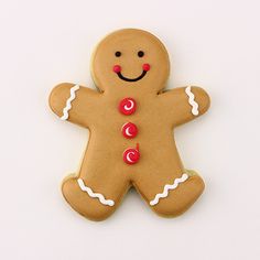 a ginger cookie with white icing and red buttons